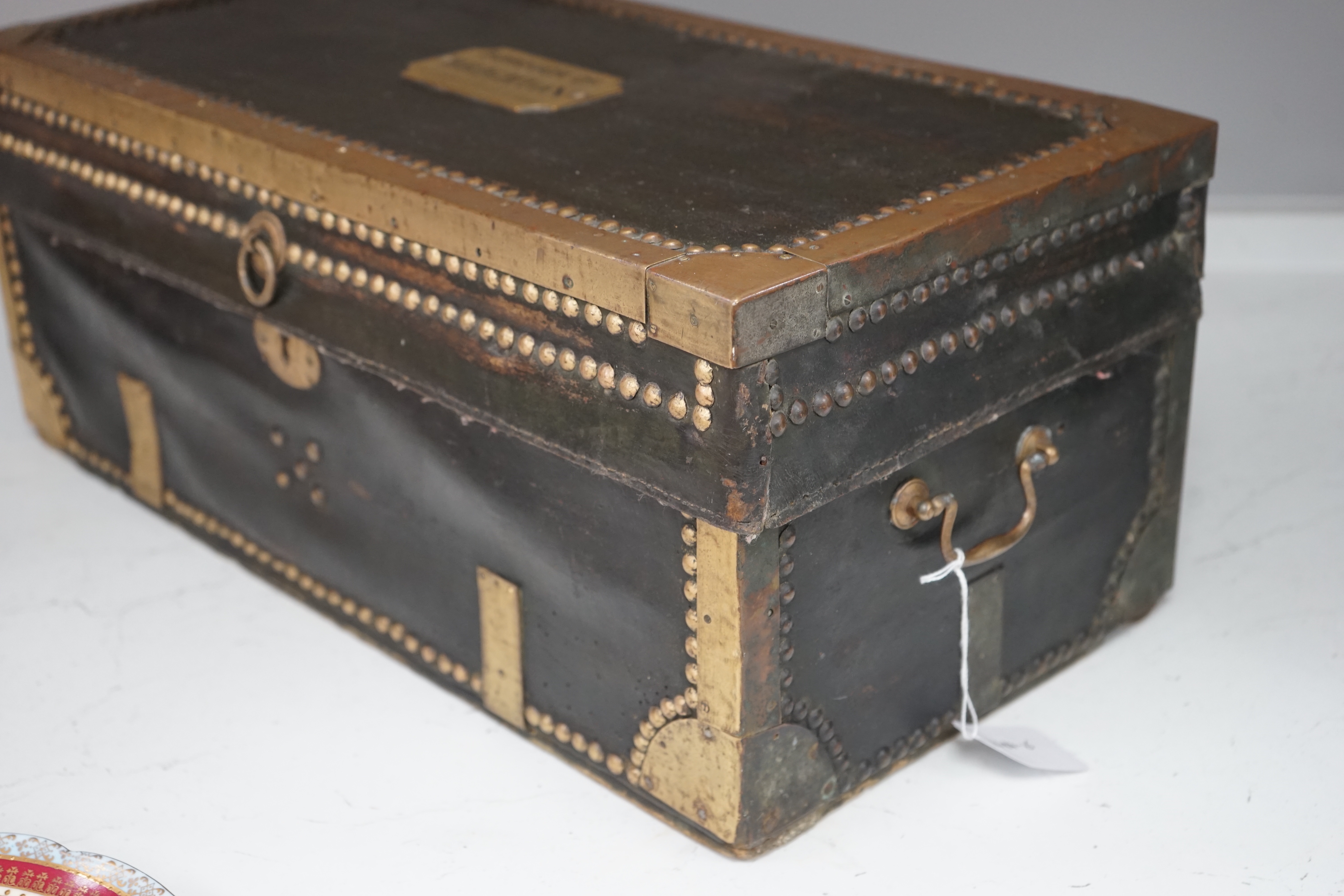 A 19th century leather and brass bound trunk with Avery Ltd applied brass plaque; 'Borough of Brighton', 54cm x 26.5cm x 22cm